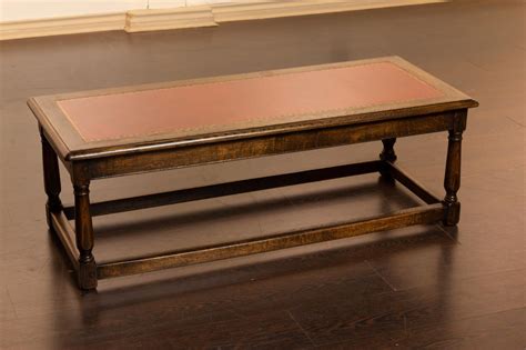 Solidly built with grade a teak. Lot - An oak coffee table, 16 1/4 x 48 x 20 in. (41 x 122 ...