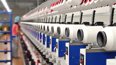 Textile Fabric Manufacturing Machines In Work Woman Working In Factory