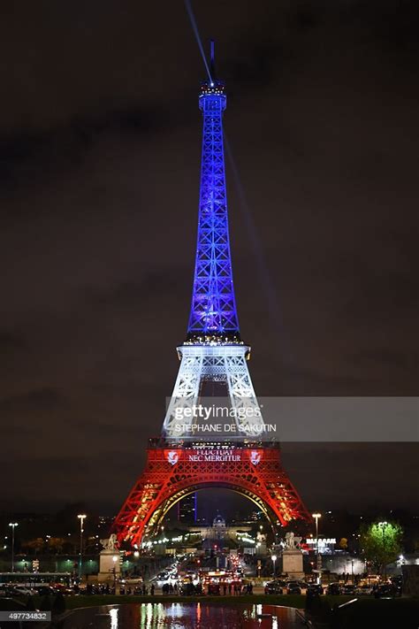 The Eiffel Tower Is Illuminated With The Colors Of The French News