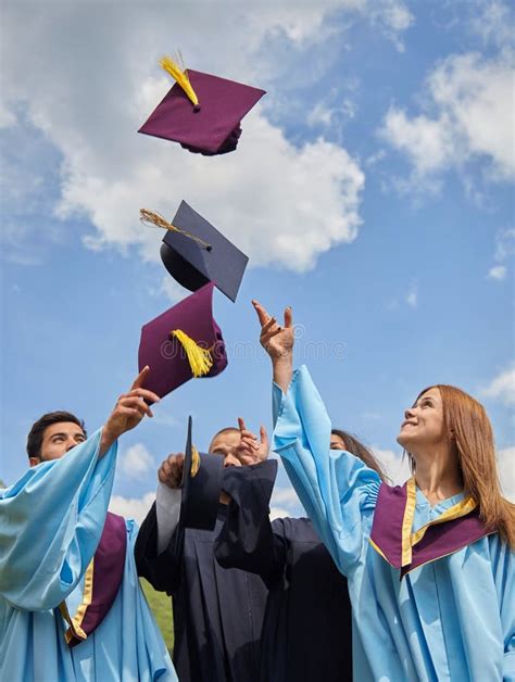 Group Of Students In Graduation Gowns And Caps Stock Image Image Of