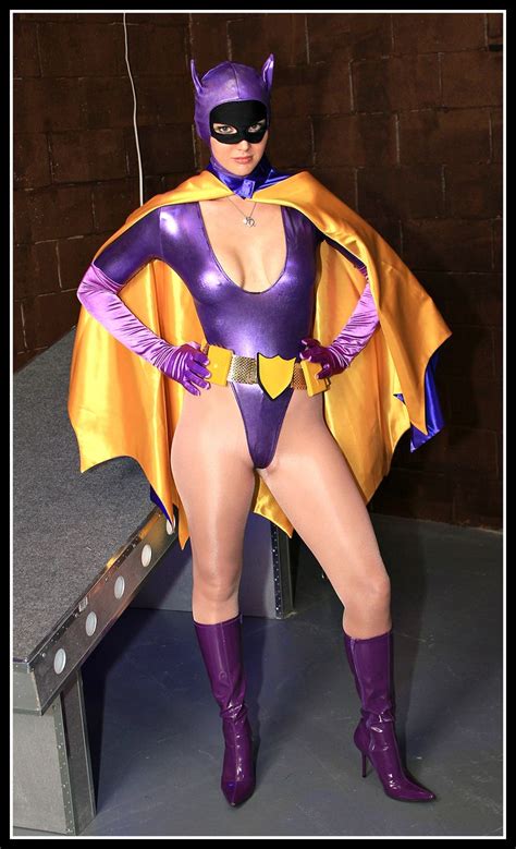 A Woman In A Purple And Yellow Costume