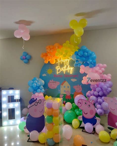 Peppa Pig Balloons Are On Display In Front Of A Birthday Sign And