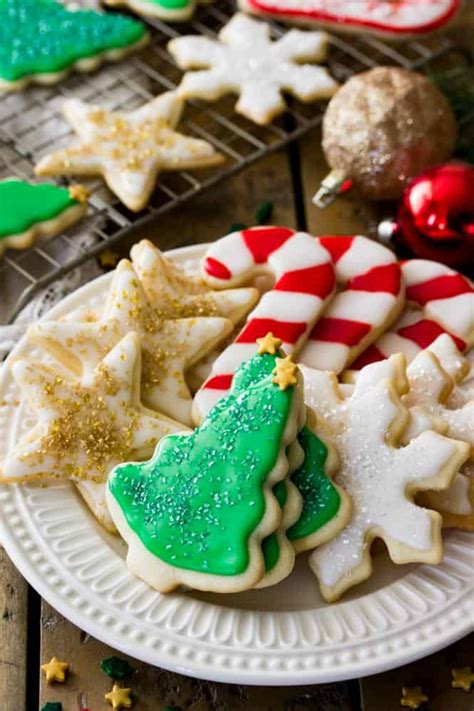 These melting snowman cookies are absolutely adorable! 100 Easy Christmas Cookie Recipes You Must Try this Christmas! - Mom Does Reviews