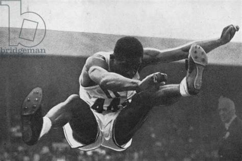 Willie Steele On His Way To Winning A Gold Medal For The Long Jump In