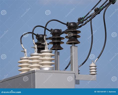 Electric Transformer With Wires And An Insulator Against The Sky Stock
