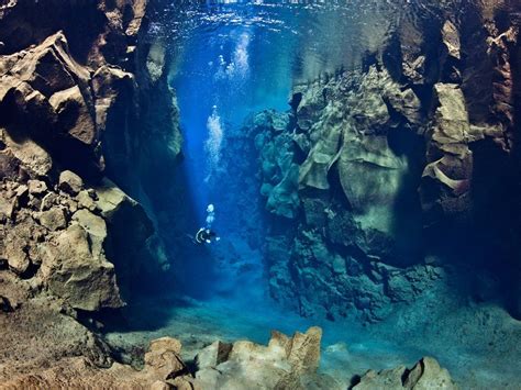 A Diver Swimming Between Two Tectonic Plates Iceland Pics