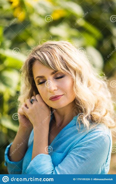 Vertical Close Up Portrait Of Beautiful Blonde 40 Years Old Woman With