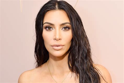 kim kardashian just dyed her hair silver blond for fashion week and yes it s real glamour