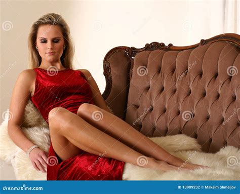 Lady Wearing Red Dress Lying On A Sofa Stock Photo Image 13909232