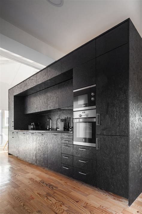 Osb will absorb any and all moisture and swell, then it will kick the paint off and rot. A black-painted OSB box occupies a kitchen on one side in ...