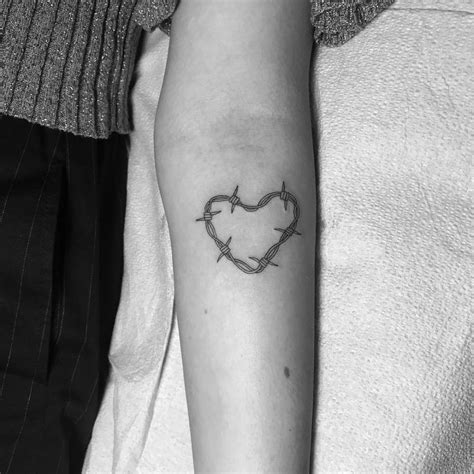 Barbed Wire Heart Tattoo On Dua Lipas Inner Forearm