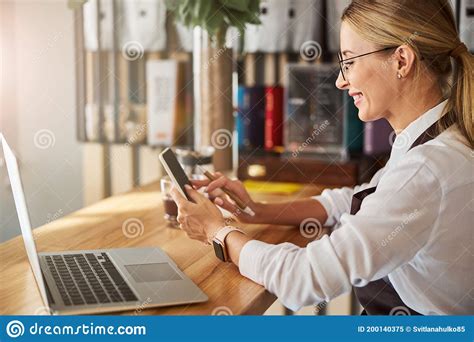 Happy Cheerful Woman In White Shirt Typing Message On Cell Phone Stock