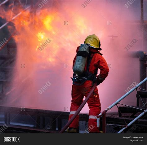 Firefighter Using Image And Photo Free Trial Bigstock