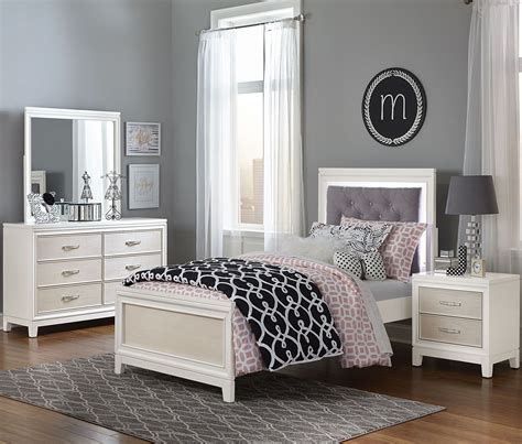 This gray children's bedroom is part of a coastal maine retreat. Evelyn White and Light Grey Youth Upholstered Bedroom Set from NE Kids | Coleman Furniture