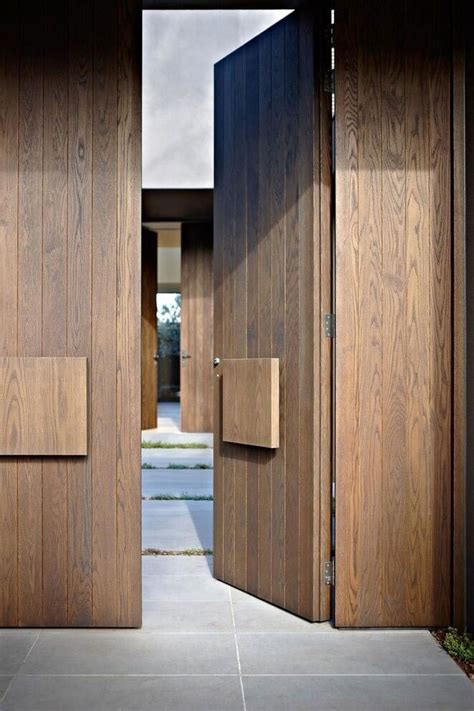 Here is a modern steel gate design that works in a sliding. House colors: Amazing modern facade in brown - Architecture Beast