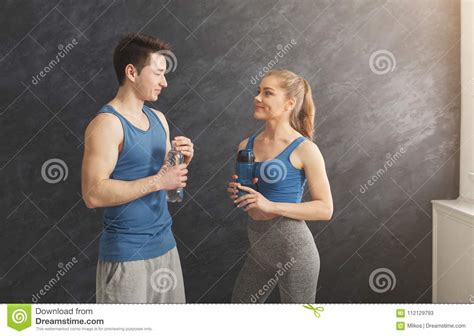 Fitness Couple Drinking Water At Gym Stock Image Image
