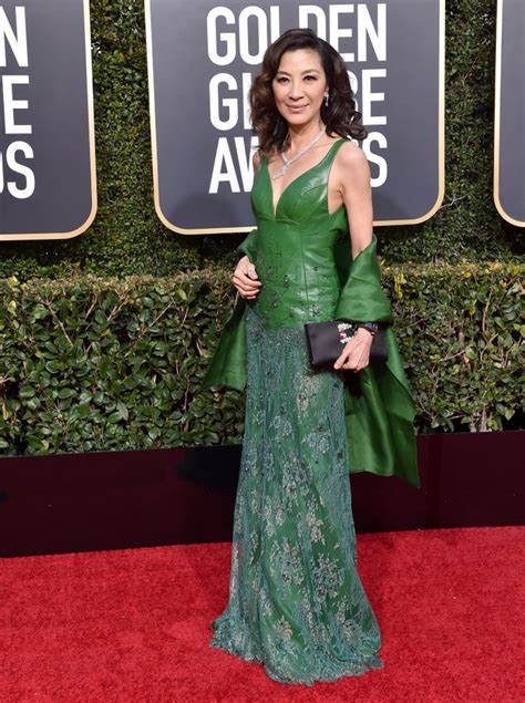 Michelle yeoh was already a fan of kevin kwan's crazy rich asians novels that the film is based off, but something wasn't right about peter chiarelli and adele lim's original script. Michelle Yeoh Wears Crazy Rich Asians Ring at Golden ...