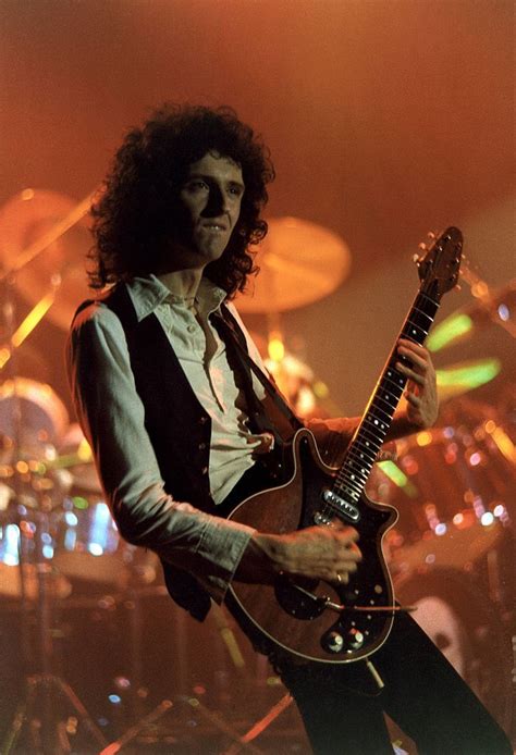 Designed by, and named after, arielle, it's . Photo of Brian MAY and QUEEN, Brian May performing on ...