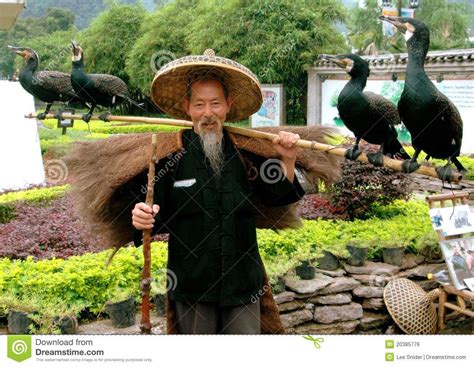 Yangshuo China Man With Four Comorrant Birds Yangshuo Chinese Hat