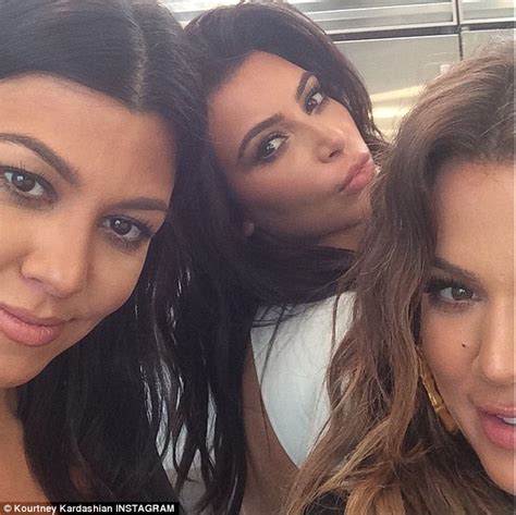 khloe and kourtney kardashian smile in instagram snap while kim strikes a sexy pout on set of