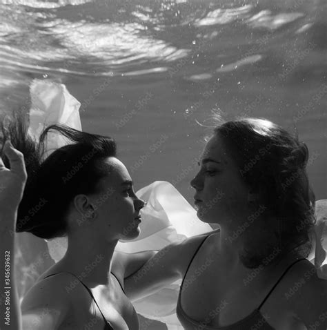 two beautiful lesbian girls are swimming underwater attractiveness sexual poses and gestures