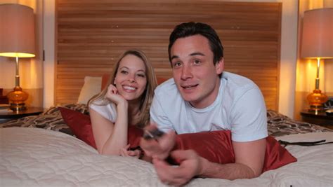 These vastu tips for bedroom for married couple can improve husband wife relationship. Couple Laying in Bedroom Watching Stock Footage Video (100 ...