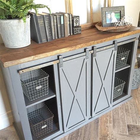 Choose the dining room table design that defines your family's style and character. Close-up of the gray sliding barn door console table for ...