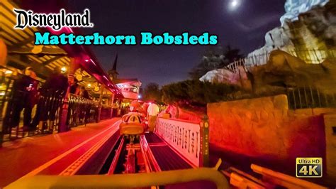 matterhorn bobsleds roller coaster on ride low light front seat 4k pov disneyland 2022 03 17