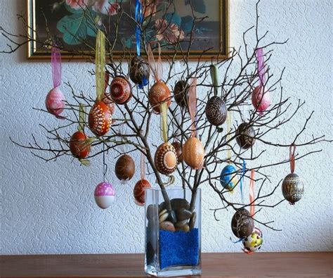 A Vase Filled With Eggs Sitting On Top Of A Wooden Table Next To A Tree