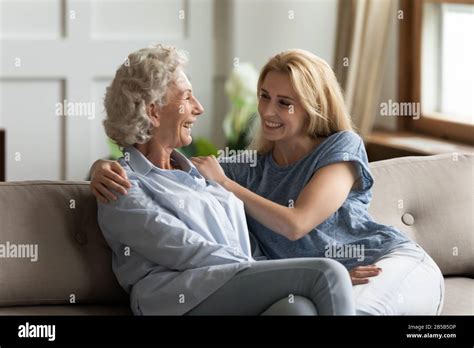 Happy Mature Mom And Adult Daughter Relax At Home Stock Photo Alamy