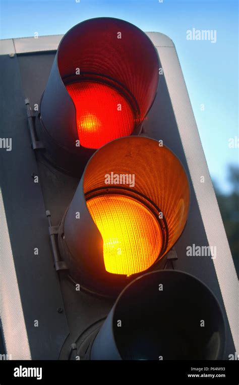Traffic Lights Showing Amber And Red At A Crossroads Uk Stock Photo
