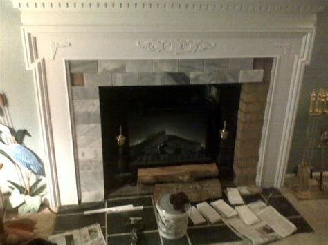 Even neutral tiles develop an outdated appearance after a few years of use. fireplace mantle- cover ugly brick - Traditional - Living ...