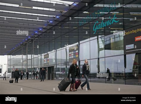 Passengers Approach The Public Entrance To Gatwick Airports North