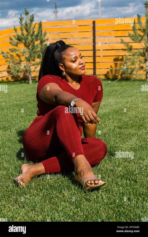 Summer Portrait Of Beautiful African American Woman In Red Casual Wear Standing On Backyard