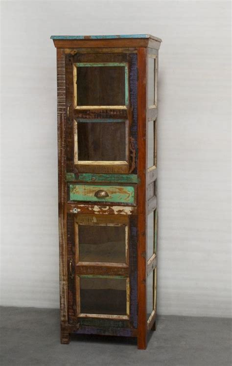 Maybe you would like to learn more about one of these? Tall narrow display cabinet with 2 doors center drawer. 1 ...