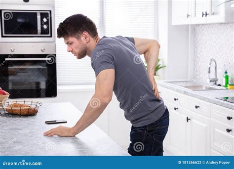 Young Man Suffering From Back Pain Stock Photo Image Of Backache