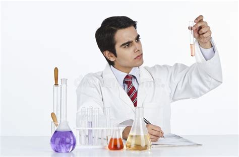 Scientist Doing Scientific Experiment In A Laboratory Stock Photo