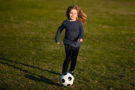 Soccer Kid Kids Play Football On Summer Stadium Field Little Child