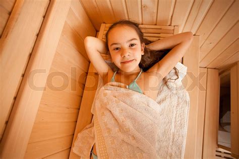 Portrait Of Little Girl Lying At Sauna Stock Image Colourbox