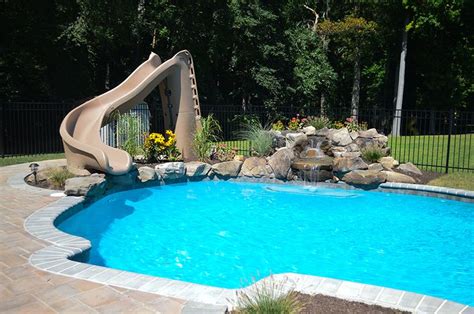 A Pool With A Slide In The Middle