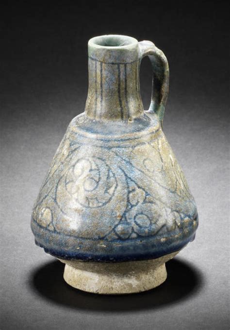 a seljuk monochrome incised pottery jug persia 12th 13th century of pear shaped form on a