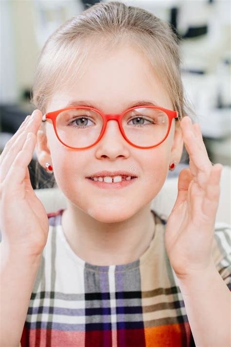A Pretty Little Girl In Colored Rimmed Glasses Glasses For Children
