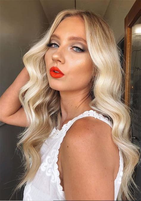 Sleeky white hairstyle suits women above 50 who have limited time to maintain their hair. 49 Flirty white wavy hairstyle for long hair and medium ...