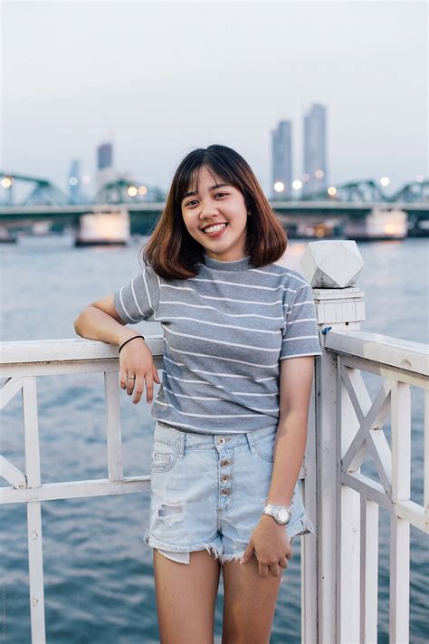 Happy Thai Teenage Girl Portrait By The Riverside In Bangkok By Stocksy Contributor Nabi Tang