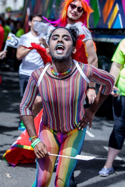 Someone Celebrating Pride In London Un A Very Colourful Rainbow Outfit He Is Wearing It All