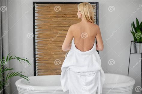 a beautiful woman in a white bath robe showing her naked back stock image image of white