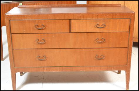 Classic design that consists of 3 drawers and 3 doors. A mid 20th Century vintage retro Gordon Russell bedroom ...