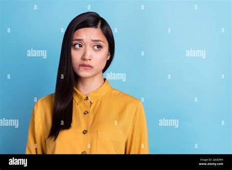 Photo Of Young Attractive Asian Girl Unhappy Upset Worried Nervous Bite Lips Fail Look Empty