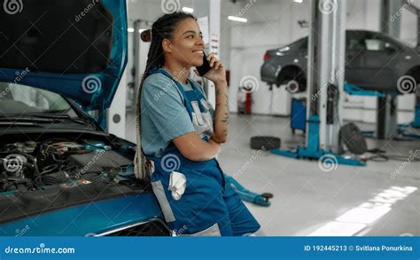 Young African American Woman Professional Female Mechanic Talking On