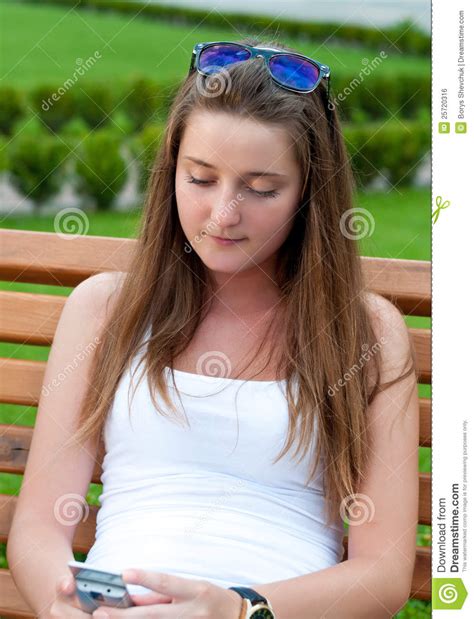 Girl On The Bench With Mobile Phone Stock Photo Image Of Nature